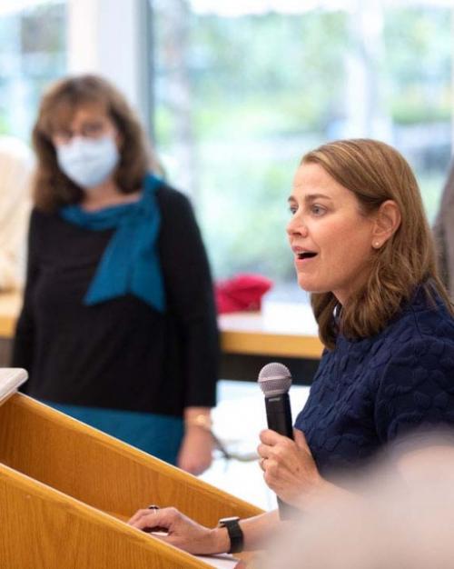 		Dean Colleen Barry with microphone in hand, speaking at podiumSchool of Public Policy
	