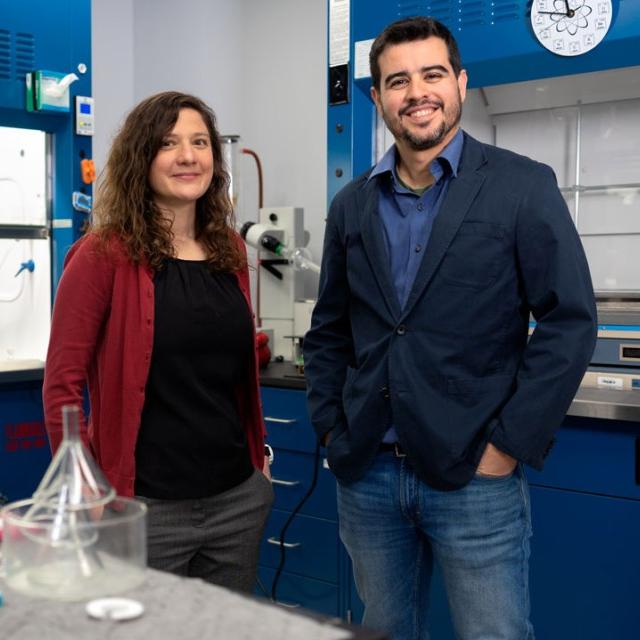 		Two people stand in a lab
	