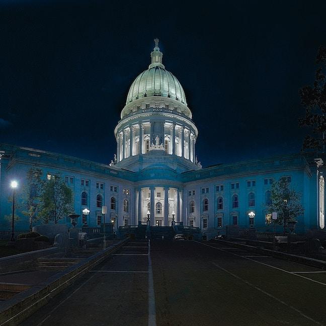 		White domed building lit up at night
	