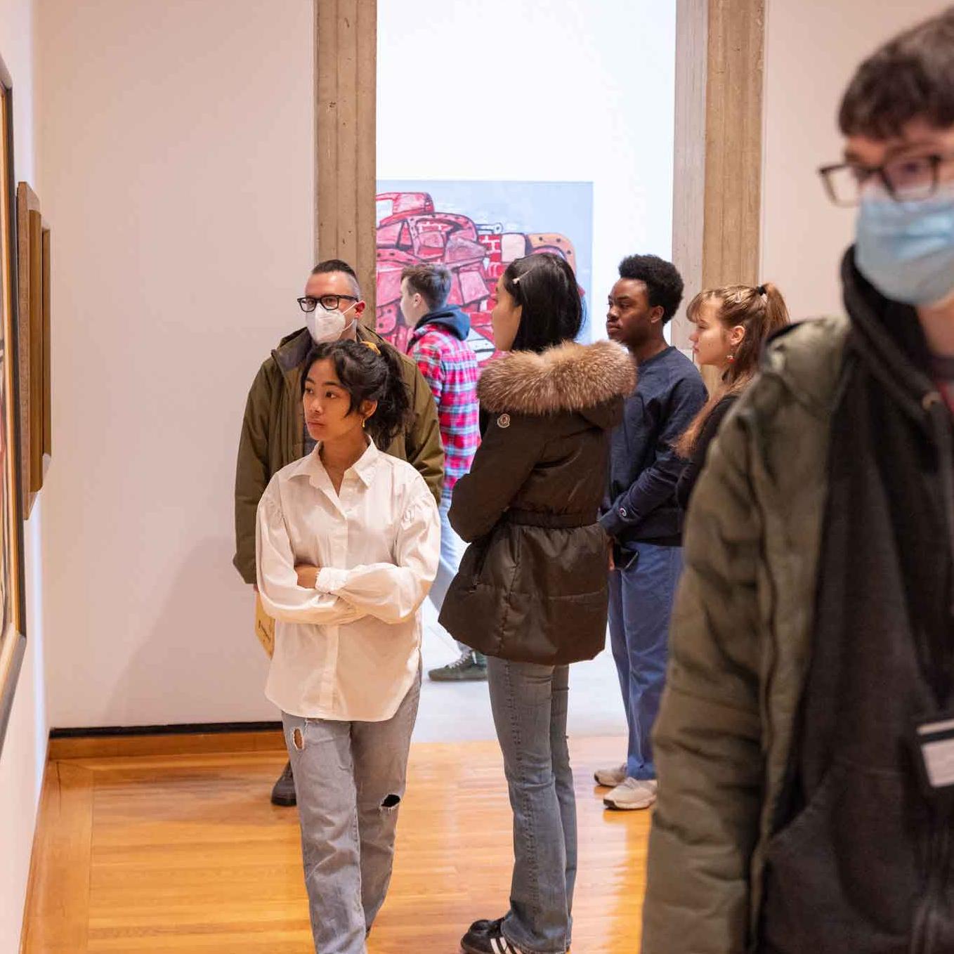 		students looking at museum paintings
	