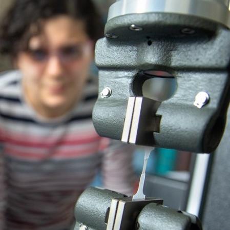 		Omar Padilla-Vélez and Renee Sifri examine the tensile strength of a high-density polyethylene “dog bone.”
	