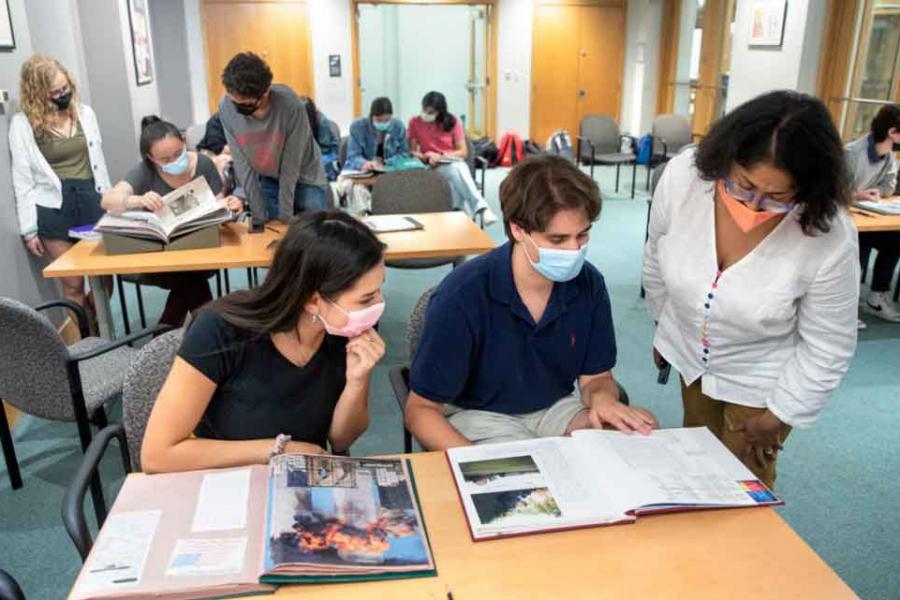 students look at a book