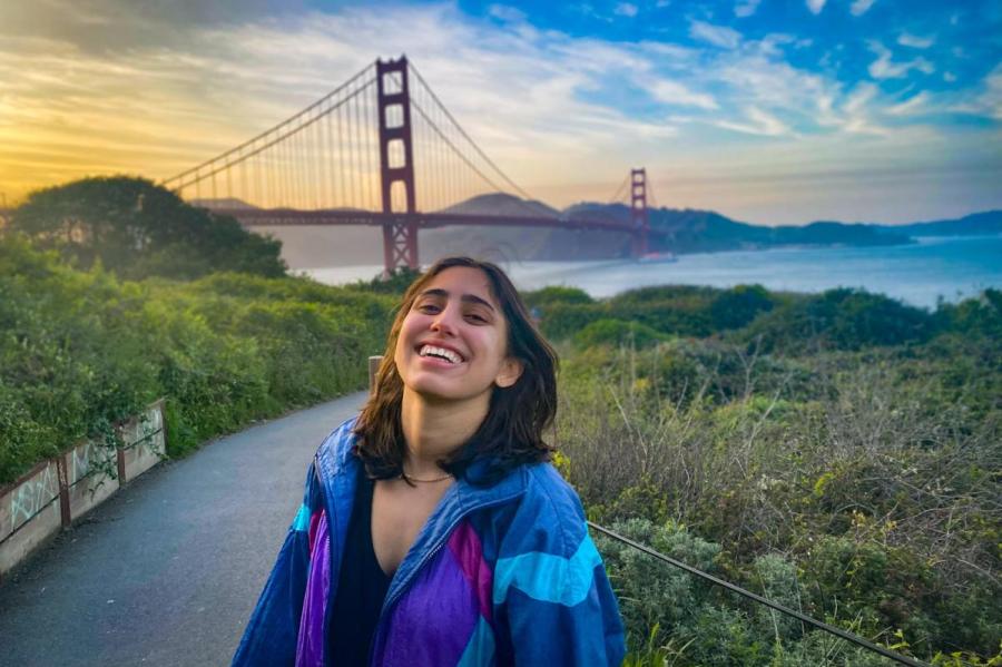 girl with bridge in background