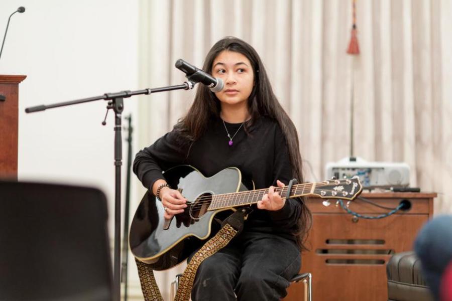 woman playing guitar