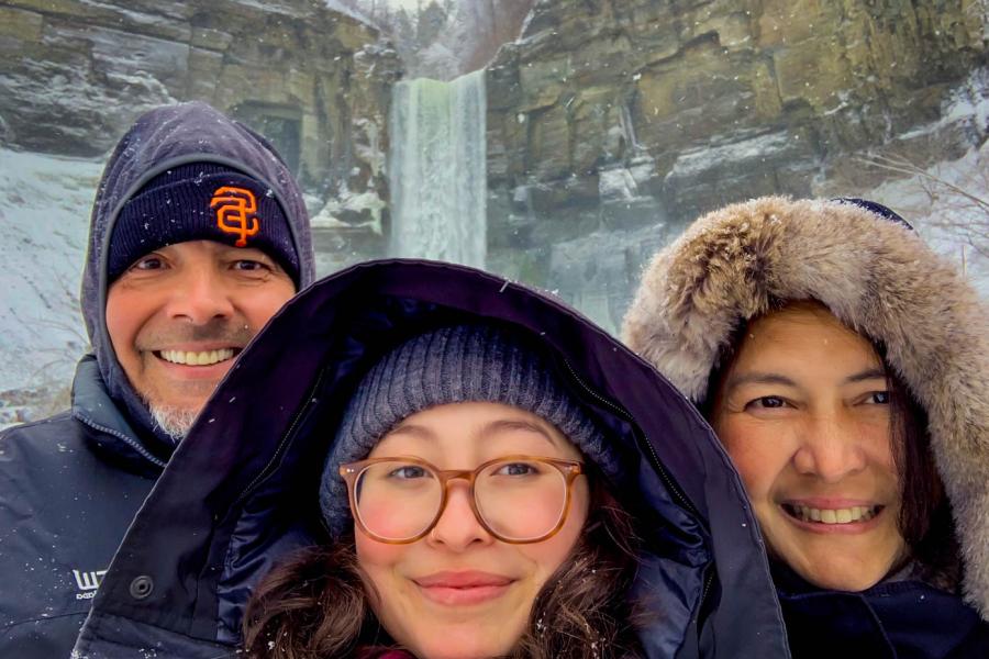 three people at waterfall