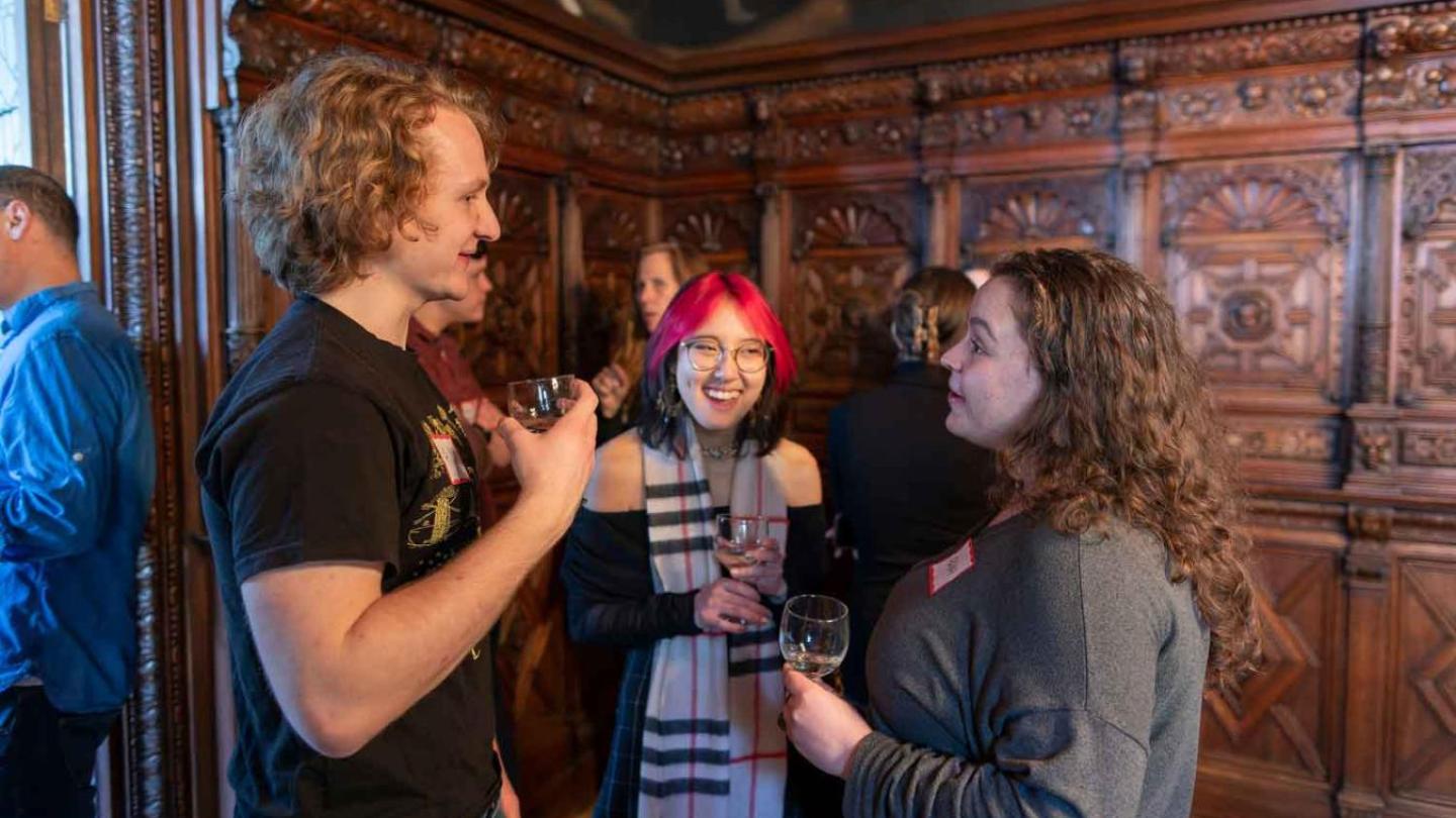 three students chatting