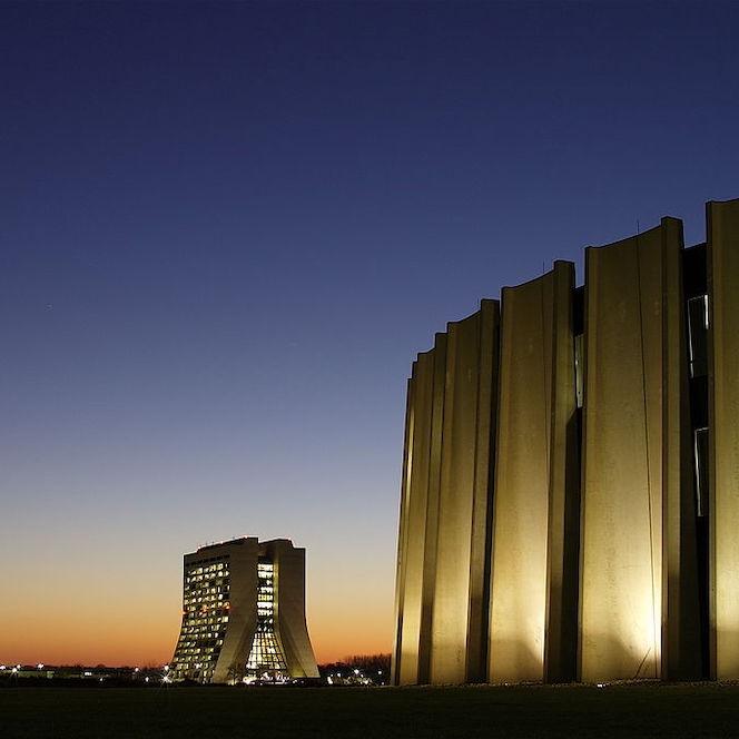 Modern building, illuminated windows a sunset