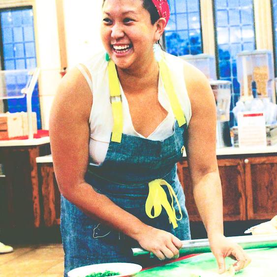 Person cooking in a dining hall