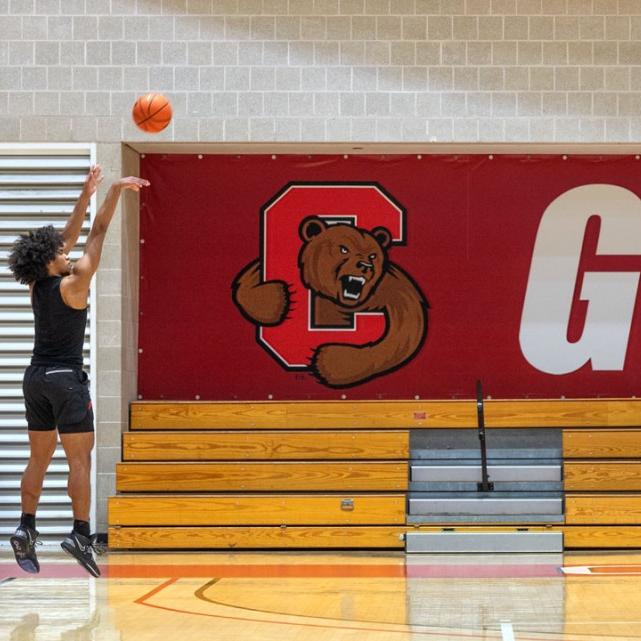 Person shooting a basketball