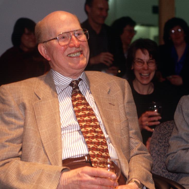 		People in an audience, smiling
	