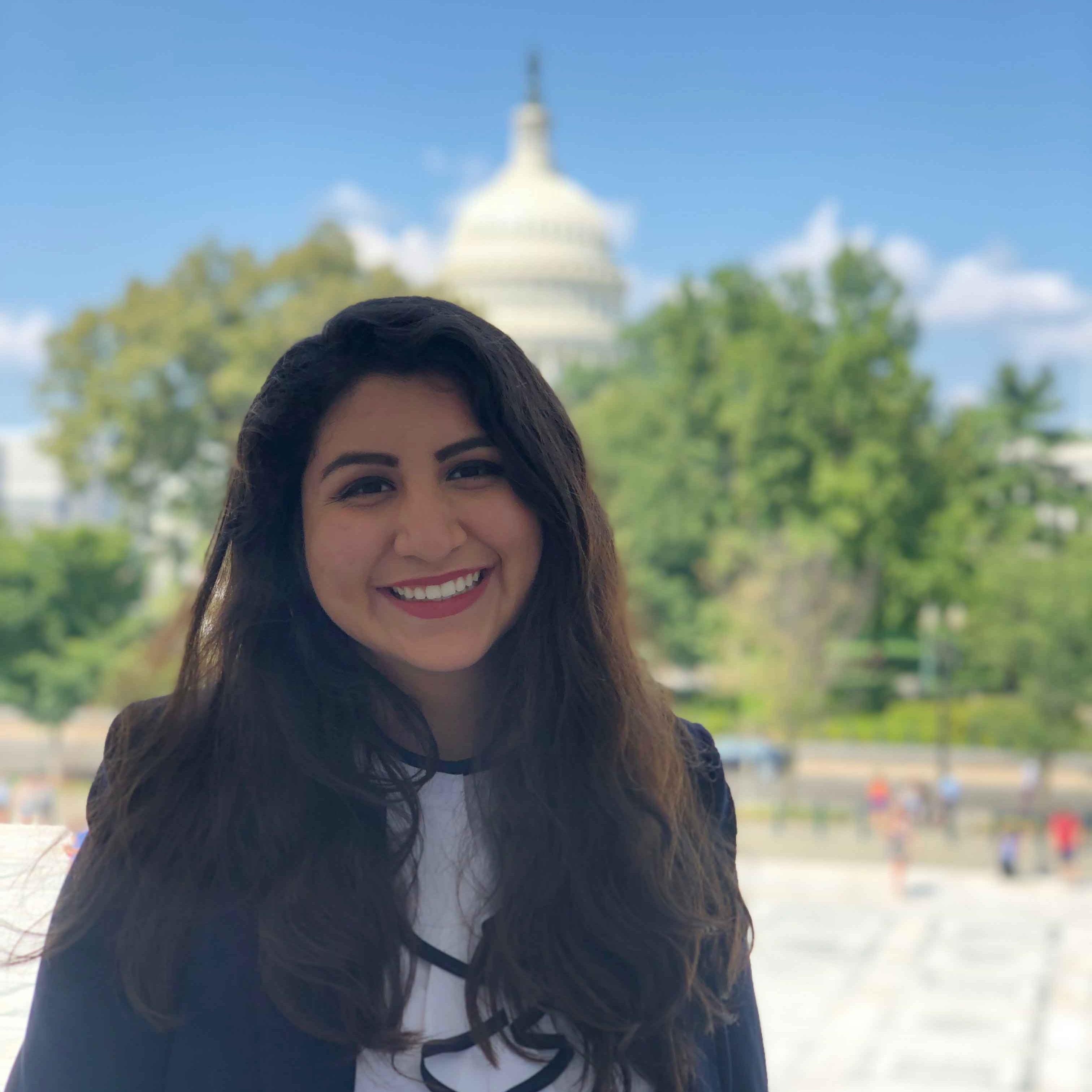 		woman outside the capitol building
	