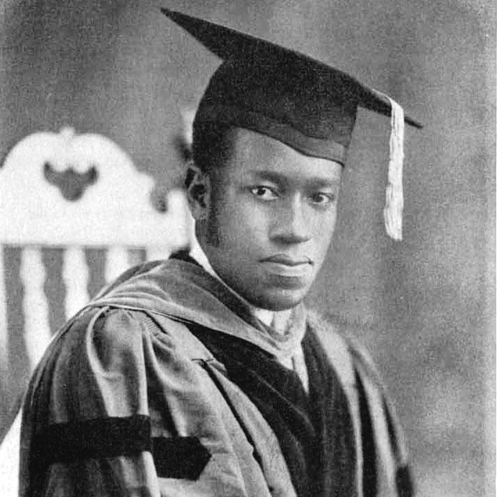 		Elbert Cox: a black and white portrait of a person wearing doctoral regalia
	