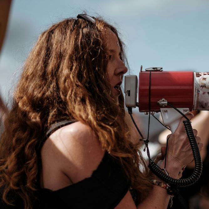 Person speaking into a megaphone