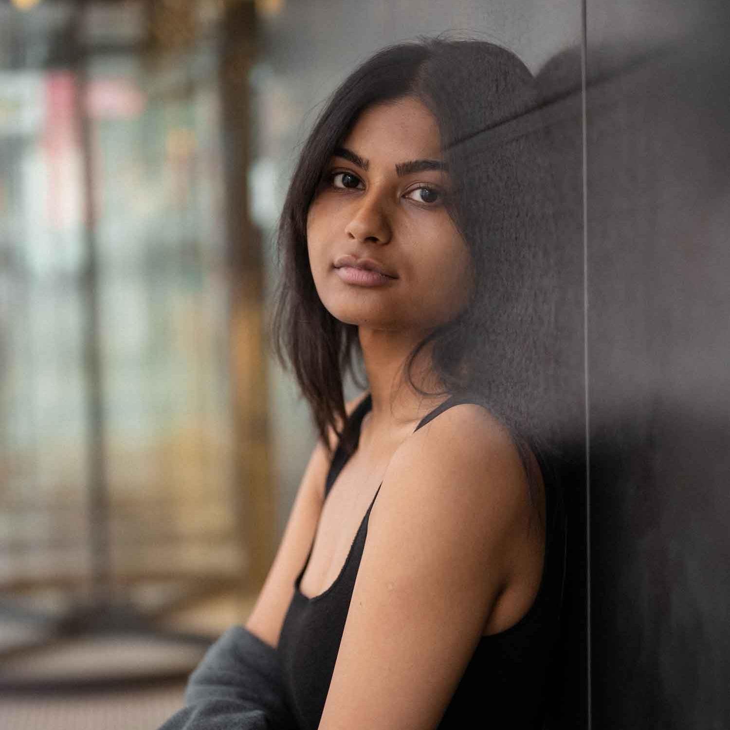 woman standing by wall