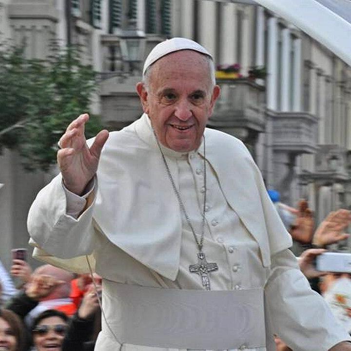 Pope Francis waves to a crowd