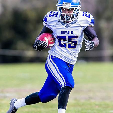  Black football player running with the ball