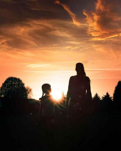 mother and daughter in field