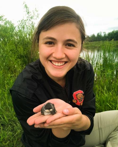 girl holding bird