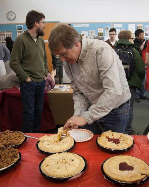 Person serving a piece of pie