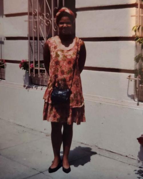 girl standing outside building