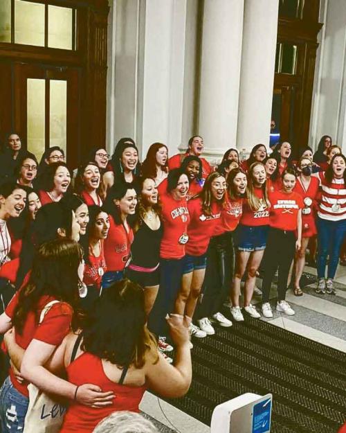 people singing in Goldwin Smith Hall