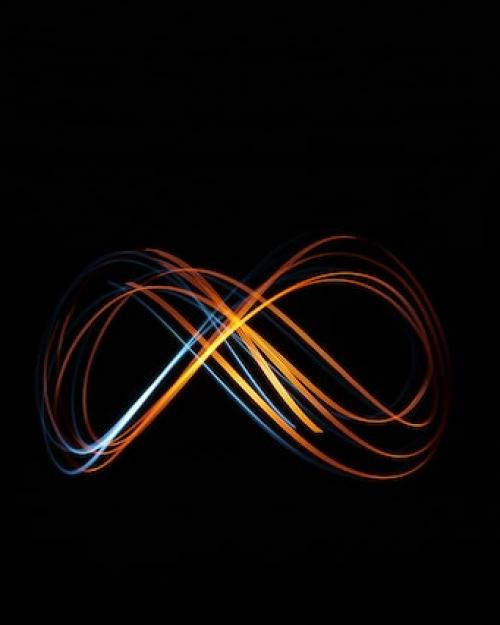 Multi-colored ribbons of light form the infinity symbol