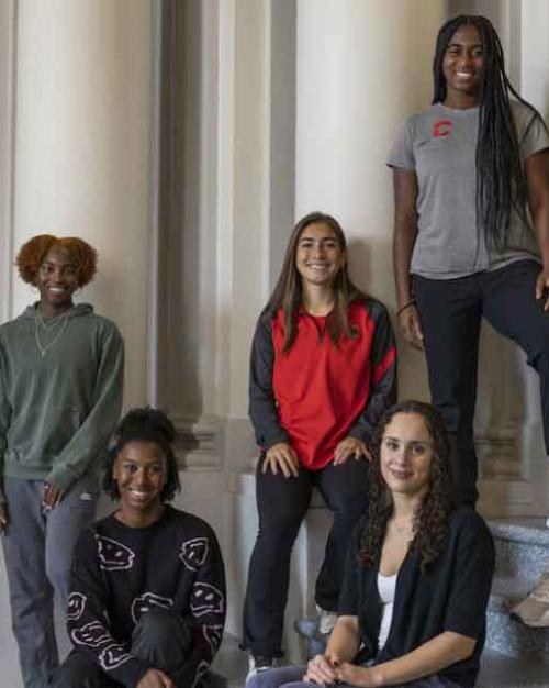 six women on steps of Goldwin Smith Hall