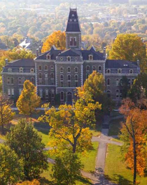 old building with fall leaves