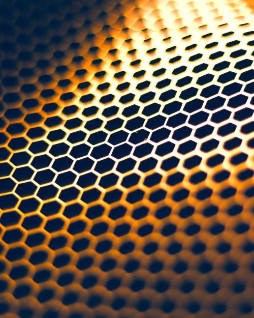 Golden honeycomb pattern over black