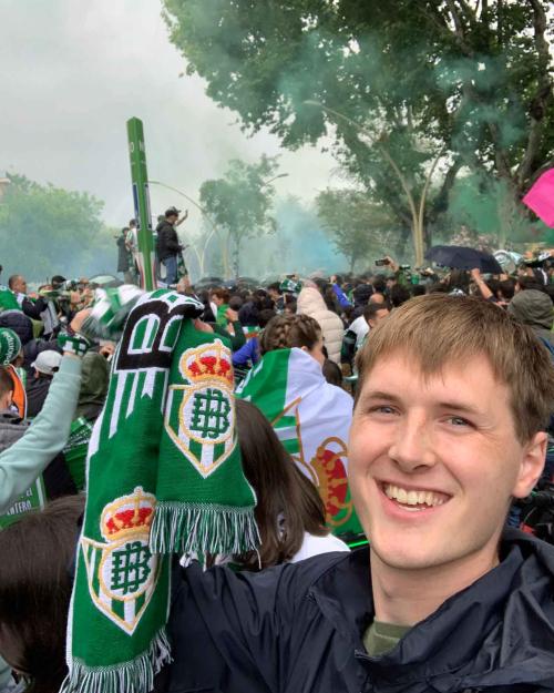 man at rally of lots of people