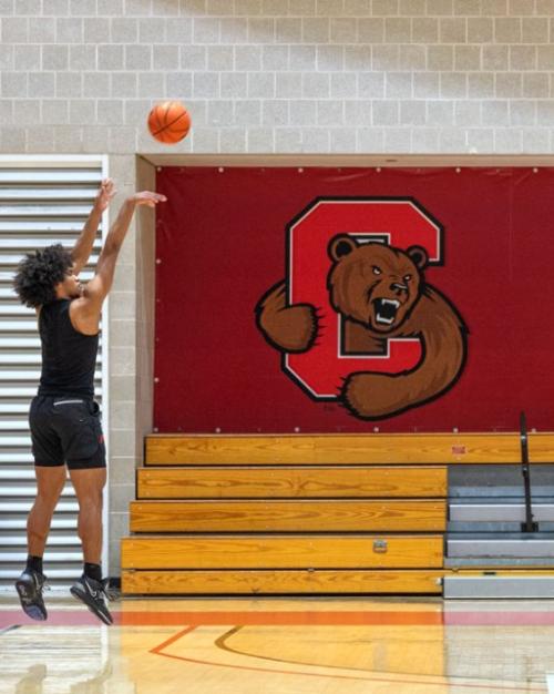 Person shooting a basketball