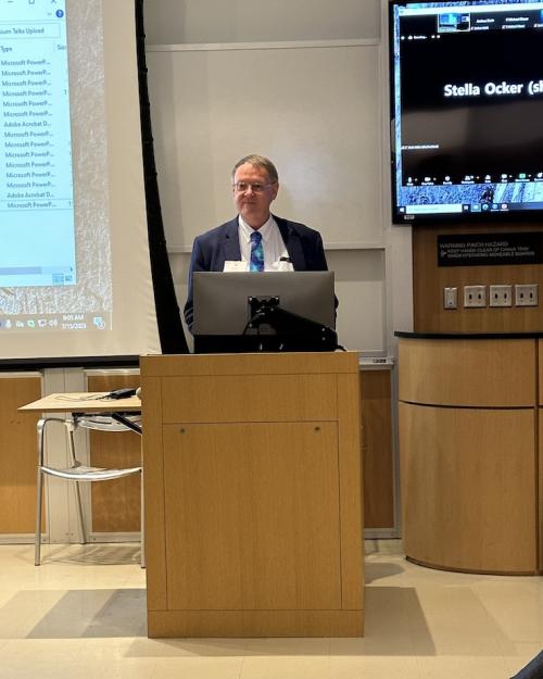 Person standing at a podium