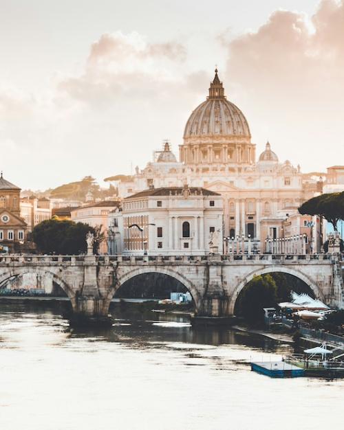 		Rome at sunrise: Cathedral dome in the distance, bridge in the foreground
	