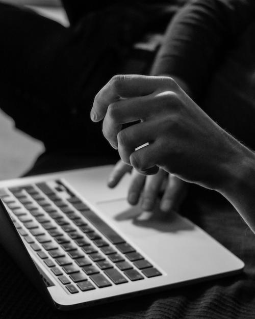 hands typing on a computer