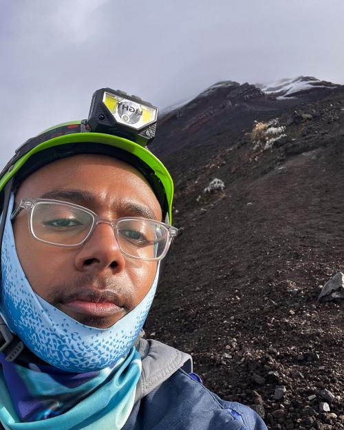 person climbing a mountain