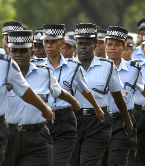  Royal Solomon Islands Police Force female officers march down the main street of Honiara on International Women’s Day, 8 March 2010