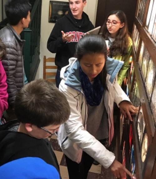  A group of students observe an object on the floor