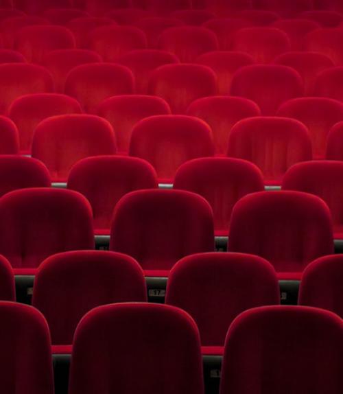  Rows of empty red theater seats