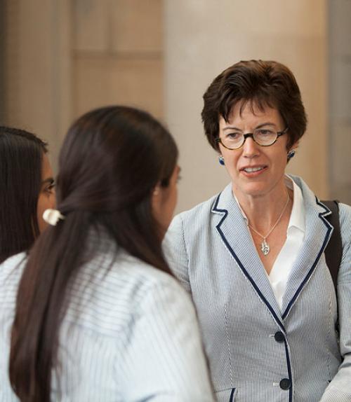  Gretchen Ritter talks with a student