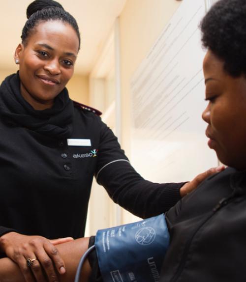  Woman taking blood pressure