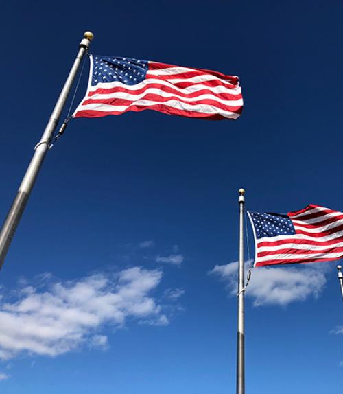  Two American flags on poles