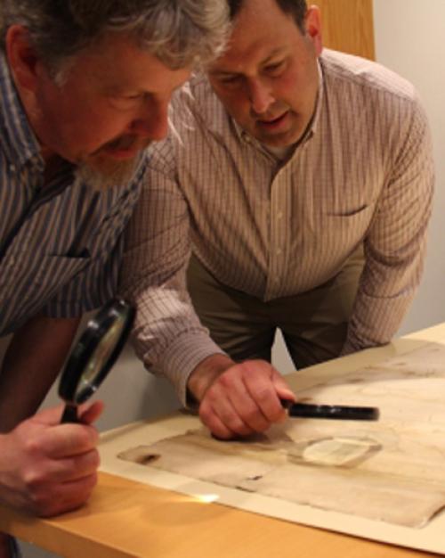  Two men looking at a map