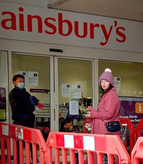  People queue at a store