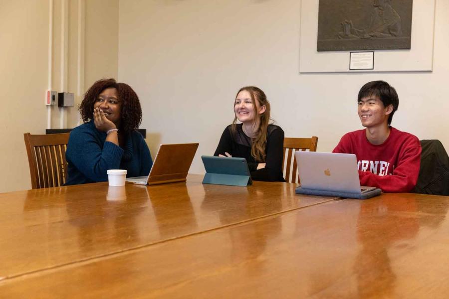 three students at a table