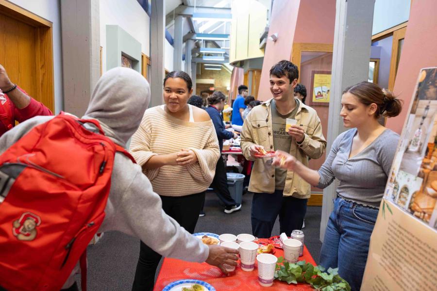 students picking up drinks and talking