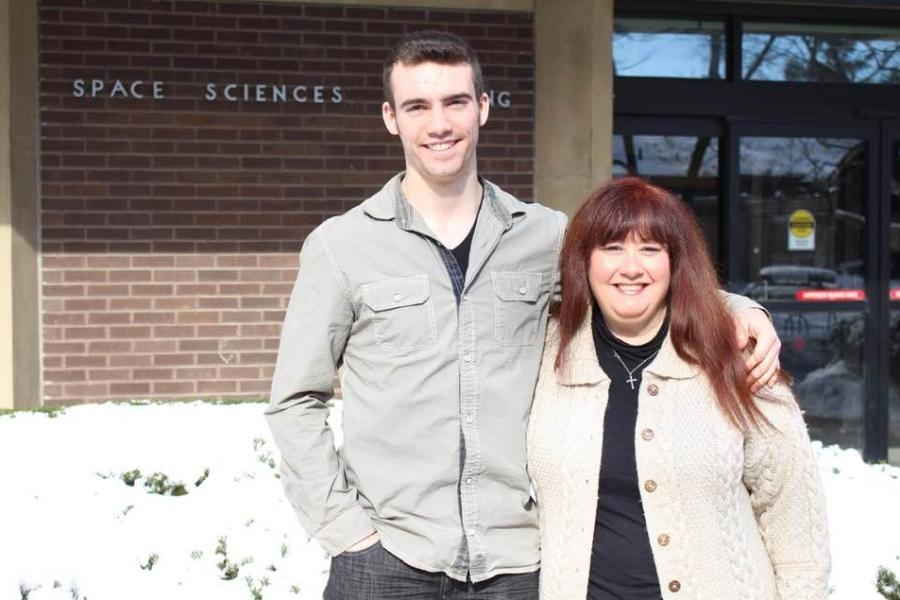 two people outside Space Sciences building