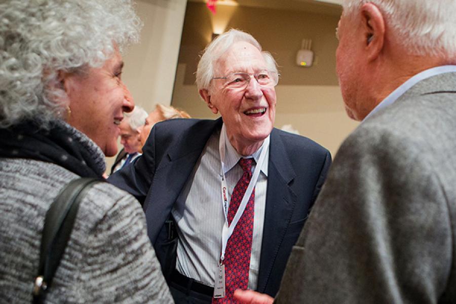 Three people, talking and smiling